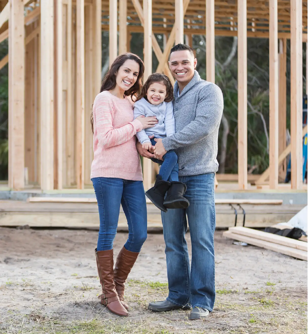 A happy family at their new home construction site